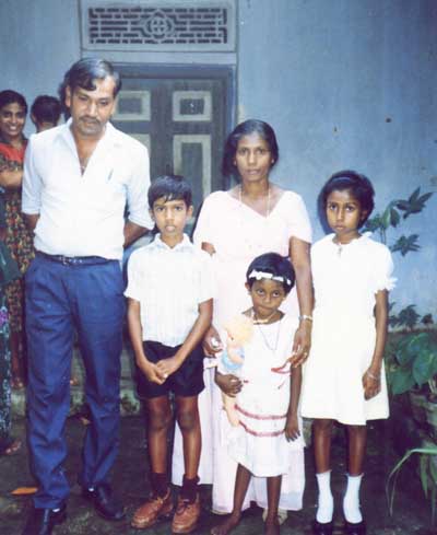 Diluskshi poses with former family
