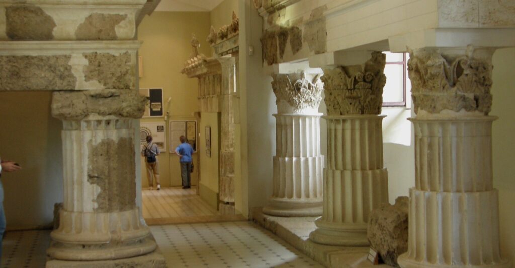 Asclepieion at Epidaurus, which contains inscribed descriptions of cures attributed to the healing powers of Apollo and Asclepius.